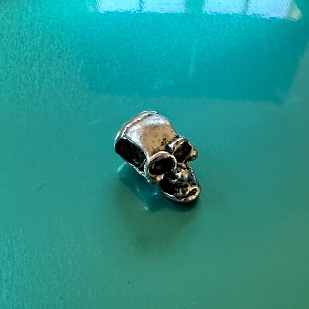 Silver skull charm